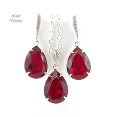 "Brighten up your mood instantly with this elegant and sparkly Swarovski Dark Red Jewelry Set! These dazzling fancy crystals are designed with incredible facets that produce the famous Swarovski sparkle. Earrings and Necklace Jewelry Set made with: - the gorgeous and Genuine 18x13mm Siam Swarovski teardrop pear shaped fancy stones, set in sterling silver plated settings - Hypoallergenic Rhodium plated rhinestone ear hooks - the earrings are about 1 1/2\" top of the ear wire to bottom of the ston Red Rhinestone Jewelry For Evening, Evening Red Jewelry With Rhinestones, Red Bling Jewelry For Evening, Dazzling Red Jewelry For Party, Red Cubic Zirconia Jewelry For Evening, Red Crystal Earrings For Formal Occasions, Red Jewelry With Earrings For Evening, Red Crystal Earrings With Rhinestones For Evening, Formal Red Dangle Jewelry Sets