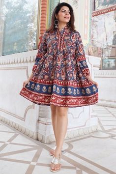 Discover the charm of traditional Indian craftsmanship with our exquisite Kalamkari Jaipuri print knee-length dress. Handcrafted from soft Indian cotton, this dress features a captivating blend of vibrant blue and rich red hues in intricate Jaipuri patterns. Perfect for both casual and festive occasions, it offers comfort, style, and a touch of cultural elegance. Elevate your wardrobe with this unique piece that celebrates India's rich textile heritage Model is wearing size S and is 5'feet 4 inc Traditional Paisley Print Kurta For Festive Occasions, Traditional Festive Kurta With Paisley Print, Red Traditional Kurta With Floral Print, Long Sleeve Paisley Print Kurta For Festive Occasions, Festive Long Sleeve Kurta With Paisley Print, Festive Long Sleeve Paisley Print Kurta, Traditional Paisley Print Kurta For Festivals, Traditional Kurta With Paisley Print For Festivals, Festive Paisley Print Straight Kurta