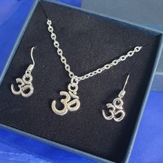 Silver plated om necklace and earring set. - Necklace length is the most popular length of 18 inches, however you can choose which length you would like too, please send or leave me a message. Buying as a gift? Why not upgrade your gift wrapping? See the gift wrapping upgrade section of my shop or see here  https://etsy.me/3iivznc Want more charms added to personalise your necklace? Including more initials and birthstones etc, See the add on charms section of the shop or see here https://etsy.me Om Necklace, Set Necklace, Necklace And Earring Set, Gifts Birthday, Silver Gifts, Silver Chain Necklace, Necklace Earring Set, Necklace Length, Shop Policies