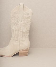 An elevated western boot with chic, statement-making details. Dress them up or dress them down, however you wear them, the AMAYA this IT style adds instant style points. Perfect for summer festivals and transitional style.Shaft Height: 10"Heel Height: 2.25"Types of closures: slip onCircumference of shoe opening: 14" Bohemian Boots For Ranch In Fall, Beige Suede Boots For Spring, Western Style Suede Boots For Spring, Trendy Summer Boots For Rodeo, Beige Pointed Toe Boots For Summer, Casual Summer Ranch Boots, Western Summer Boots With Round Toe, Chic Boots With Stacked Heel For Rodeo, Spring Western Heeled Boots With Round Toe