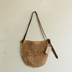 This woven tote market bag is made from an all-natural, plant-dyed cactus fiber with an adjustable leather tie strap to wear over the shoulder. Made by skilled artisans. Make this bag your go-to for all farmers market trips and beach days. Every Minga bag has been ethically sourced for a mutually agreed upon, fairtrade price and provides work to our artisan partners, a collaborative group of 18 women living in a remote region of Ecuador. Approximately 18" x 10" Leather Tie, Plant Fibres, Market Tote, Natural Plant, Market Bag, Reusable Bags, Beach Days, Natural Dyes, Beach Trip