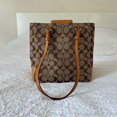 Used / Pre-Owned Square Monogram Canvas Bag For Daily Use, Daily Use Monogram Canvas Square Bag, Monogram Canvas Square Bag For Daily Use, Brown Monogram Canvas Rectangular Bag, Monogram Canvas Shoulder Bag For Errands, Chic Rectangular Monogram Canvas Bag, Monogram Canvas Bag With Double Handle For Daily Use, Monogram Canvas Bags For Errands, Monogram Canvas Tote Bag For Shopping