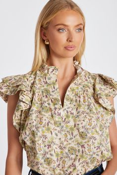 A wear-everyday hero, the Margarita Poplin Top features ruffled mandarin collar with split v-neck and double layer ruffle sleeves that adds soft romance to this versatile top. Throw it on over our Dolan D-Ring Pant or your favorite jeans, skirts, shorts—you name it. K4ETW2627C-ANP Chic Ruffled Split Neck Blouse, Chic Split Neck Blouse With Ruffles, Casual Ruffled Split Neck Blouse, Poplin Top, Everyday Heroes, Blazer Vest, Mandarin Collar, Sweater Shop, Favorite Jeans