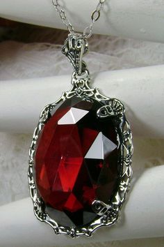 "Red Garnet Cubic Zirconia Pendant Bubble Design#P10 Custom Made Inspired by Victorian era designs, I now offer this lovely Antique reproduction in sterling silver. The flawless 22ct faceted Red Garnet Cubic Zirconia (CZ) is 24mm long (15/16th\") and 18mm in width (3/4th\"). The entire pendant is 1 1/2th inches long and 7/8\" wide. The chain (if chosen) is between 18-20 inches in length and is marked 925 as well. Notice the beautiful craftsmanship of the Victorian filigree setting. This pendant Red Gothic Necklace For Formal Occasions, Red Victorian Necklace For Anniversary, Red Filigree Jewelry For Formal Occasions, Exquisite Red Jewelry For Gift, Formal Red Filigree Jewelry, Red Ruby Victorian Necklace, Red Pendant Jewelry For Formal Occasions, Antique Red Pendant Jewelry, Red Victorian Jewelry For Anniversary