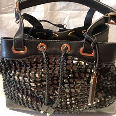 Nwt Gorgeous Vince Camuto Signature Couture Black Woven Leather Handbag With Woven Pull Cord Closure. Gold Tone Hardware. Two Braided Detail Handles. Four Feet At Bottom. Detachable Black Zippered Pouch. Detachable Gold And Wood Vc Handbag Charm. Can Be Used As Is Or With A Colorful Handbag Organizer Or Scarf Inside The Bag. Includes Vc Signature Dust Bag. 10% Discount On Bundle Of Three Or More Itemsp Designer Black Bag With Handles, Designer Black Bags With Handles, Evening Bucket Satchel With Handles, Evening Bucket Satchel, Luxury Black Satchel With Removable Pouch, Luxury Black Tote Shoulder Bag, Black Rectangular Satchel With Dust Bag Included, Black Rectangular Satchel With Dust Bag, Designer Black Bucket Bag With Double Handle