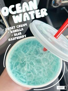 a person holding a plastic cup filled with blue liquid