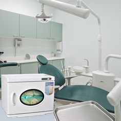 a room with dental equipment and sink in it