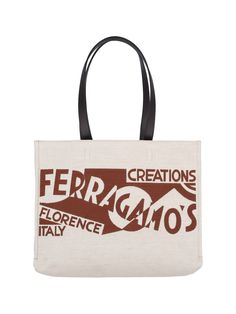 Ferragamo logo tote bag in beige canvas with brown details, two adjustable top handles in black leather, front logo print, interior zip pocket, interior flat pocket, and main interior compartment. Composition: 56% Linen, 44% Cotton Beige Top Handle Shoulder Bag With Logo, Beige Logo Tote Shoulder Bag, Beige Top Handle Bags With Logo, Designer Canvas Tote Bag For Shopping, Designer Canvas Shopping Bag With Handles, Top Handle Shoulder Bag In Coated Canvas With Logo, Designer Brown Canvas Bag With Top Handle, Brown Monogram Canvas Shoulder Bag With Logo, Top Handle Coated Canvas Shoulder Bag With Logo