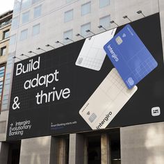 a large advertisement on the side of a building that says build adapt & thive