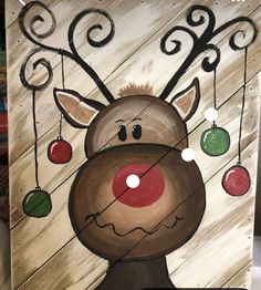 a painting of a reindeer with ornaments hanging from it's antlers and nose