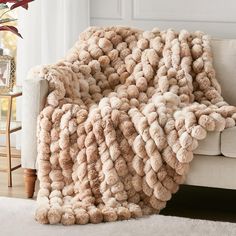 a couch with a blanket on top of it