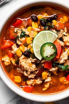 a white bowl filled with mexican chicken soup