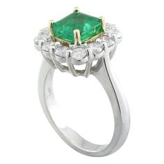 Stamped: 14K Ring Size: 7 Total Ring Weight: 6.3 Grams Emerald Weight: 2.30 Carat (7.40x7.00 Millimeter) Diamond Weight: 0.85 Carat (F-G Color, VS2-SI1 Clarity Face Measures: 13.70x13.75 Millimeter SKU: [600026] Hallmarked Platinum Emerald Ring For Formal Occasions, Gia Certified Round Emerald Ring For Formal Occasions, Formal Emerald Rings Gia Certified, Luxury Cluster Emerald Ring With Prong Setting, Formal Cluster Brilliant Cut Emerald Ring, Formal Gia Certified Emerald Rings, Green Platinum Cluster Ring For Formal Occasions, Formal Hallmarked Platinum Emerald Ring, Luxury Emerald Ring With Center Stone For Formal Occasions