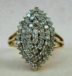 an antique diamond cluster ring in yellow gold