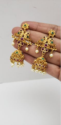 "This beautiful earrings set has an excellent finish and gives out an exquisite sense of style. If you are looking for an amazing Fashion Jewelry set for special occasions such as Anniversary, Engagement, Party, Wedding, or for gifting, then your search ends here. Handmade Indian Temple Jewelry, best to wear it for traditional ceremonies or Indian wedding. This bridal jewelry has an ethnic finish. It has Cubic Zircon stones with semi-precious ruby and emeralds. It is a Bollywood style one gram j 22k Gold Jhumkas For Wedding, Gold Peacock Design Jewelry Sets For Weddings, Traditional Gold Bridal Earrings With Peacock Design, Gold Peacock Temple Jewelry Bridal Earrings, Gold Temple Jewelry Bridal Earrings With Peacock Design, Gold Bridal Earrings With Peacock Design For Diwali, Diwali Gold Bridal Earrings With Peacock Design, Gold Bridal Earrings With Peacock Design For Festive Occasions, Festive Gold Bridal Earrings With Peacock Design