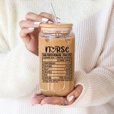 a woman is holding a jar of nutella in her hands with the label on it