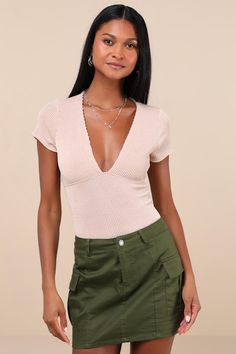 Get ready to look casual yet charming all summer long with a cute laidback look like the Lulus Stylish Appeal Cream Textured Short Sleeve Top! Textured ribbed knit shapes this flirty top with short sleeves that frame a plunging V-neckline and an empire-style waist atop a fitted silhouette that is sure to hug your figure perfectly. This anything-but-basic top is ready to be styled with any of your favorite weekday 'fits this season! Fit: This garment fits true to size. Length: Size medium measure Summer V-neck Knit Top For Day Out, Fitted V-neck Knit Top For Day Out, Stretch Short Sleeve Bodysuit For Night Out, V-neck Stretch Short Sleeve Top For Summer, Stretch V-neck Short Sleeve Top For Summer, Summer V-neck Stretch Short Sleeve Top, Spring Ribbed V-neck Knit Top, Summer Stretch V-neck Short Sleeve Top, Summer V-neck Knit Top