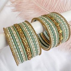 2 small half stacks of antique Gold bangles with jade green shades. Ready to Ship! Packed loose in small gift box. (No roll) Green Stackable Bangle Bracelets, Green Bangle Bracelets For Wedding, Green Adjustable Cuff Bracelet For Wedding, Adjustable Green Cuff Bracelet For Wedding, Adjustable Green Bangle For Wedding, Adjustable Green Wedding Bangle, Handmade Green Bangle For Festive Occasions, Traditional Adjustable Green Cuff Bracelet, Traditional Green Adjustable Cuff Bracelet