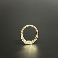 Discover our charmingly designed piercing hoop 💫, featuring a diamond-cut texture for an exquisite finish. It's the perfect accessory for septum, helix and daith piercings, adding elegance to any look. 🌟 Super comfortable and ideal for everyday wear, you'll love how it feels! 🌈 Choose from 9K, 14K, or 18K yellow, white, or rose solid gold to make it uniquely yours. Check out the options in the drop-down menu. The hoop carries the hallmark of solid gold, ensuring its quality and purity ✨. Crafted just for you! Your ring will arrive in a beautiful gift box 🎁, ready to enchant whether it's a treat for yourself or a gift for someone special. Proudly created in our cozy home studio in Rehovot, Israel 🏡, each piece of jewelry is a testament to our passion and craftsmanship. All our jewelry Gold Daith Jewelry, Helix Earrings Hoop, Daith Piercings, Gold Septum, Daith Earring, Daith Jewelry, Helix Hoop, Helix Earring, Earring Hoop