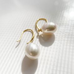 "Material:100% 925 Sterling Silver with 14K Gold Plated Main stone: Cultured Fresh Water Pearl Gemstone Other stone: N/A Weight (Pair):3.2g Size: 30mm x 10mm / 1.18\" x 0.39\" Condition:New Main color:Gold Quantity:2 pcs Pearl color:White Pearl shape: Ellipsoid Pearl luster: Very High Pearl blemish: 90% free Pearl grade:AA+ This vintage drop earings are made with 12mm Cultured Freshwater Pearl stone and solid 925 sterling silver w/ 14K gold plating for better quality and prolonged shine! *It com High Luster Drop Pearl Earrings For Gift, 14k Gold-filled Yellow Gold Drop Pearl Earrings, High Luster Drop Earrings For Gift, Teardrop 14k Gold-filled Pearl Earrings For Anniversary, 14k Gold Filled Teardrop Pearl Earrings For Anniversary, Teardrop 14k Gold Filled Pearl Earrings For Anniversary, Briolette High Luster Pearl Earrings As Gift, 14k Gold Pear-shaped Pearl Drop Jewelry, Briolette High Luster Pearl Earrings For Gift