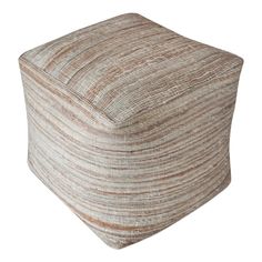 a large square ottoman with a brown and white stripe pattern on the top, sitting in front of a white background