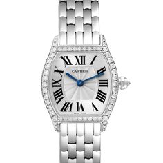 Cartier Tortue White Gold Diamond Ladies Watch WA501011. Manual winding movement. 18K white gold case 24.0 x 30.0 mm. Octagonal crown set with the diamond. Diamond lugs. 18K white gold bezel with factory Cartier diamonds. Scratch resistant sapphire crystal. Silver dial with Roman numerals. Blue sword shape hands. Secret signature at VII. 18k white gold bracelet with double deployant hidden clasp. Fits 6 1/4" wrist. Cartier Diamond Watch With Round Dial, Cartier Diamond Watch With Diamond Accents, Formal Diamond White Watch With Metal Dial, Cartier Diamond Watch With Diamond Hour Markers For Anniversary, Classic Diamond White Watch With Metal Dial, Diamond Wedding Watch With Subdials, Wedding Diamond Watch With Subdials, Classic Silver Diamond Watch With Diamond Hour Markers, Timeless Cartier Diamond Watch In Platinum