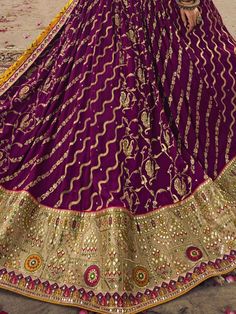 Presenting a stylish drape that suits your standard this ravishing purple color lehenga is made of viscose silk material embellished with sequin work, thread, and embroidery work. This precious purple lehenga comes with a similar color blouse of viscose silk material designed with sequin, thread, and embroidery work. It also comes with a yellow color gaji silk dupatta crafted with bandhani print work and sweet lace border. This purple wedding wear lehenga is stitched up to 42 inches. The choli w Purple Art Silk Sharara With Dori Work, Purple Floor-length Traditional Wear For Navratri, Traditional Purple Sharara With Dori Work, Traditional Purple Sharara With Traditional Drape, Semi-stitched Purple Sharara With Resham Embroidery, Traditional Purple Sharara With Drape, Traditional Purple Sharara With Dupatta, Purple Sharara For Reception With Traditional Drape, Purple Traditional Drape Sharara For Reception