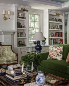 a living room filled with furniture and bookshelves