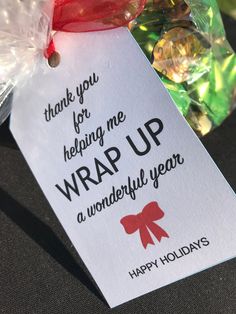 a gift tag that says, thank you for helping me wrap up a wonderful year