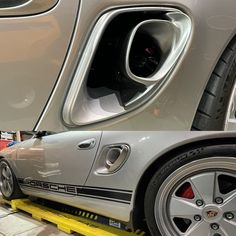 the side view of a silver sports car with its door open and yellow lifter