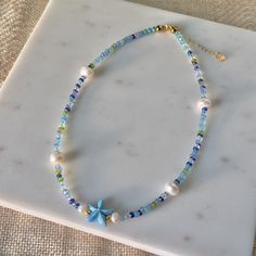 Under The Sea Freshwater Pearl Necklace | Summer Necklace | Beach Jewelry | Beaded Necklace | Coconut Girl Aesthetic | Seed Bead Jewelry by myearthyaura on Etsy Cheap Beach Jewelry With Heart Beads, Cheap Blue Necklaces For The Beach, Cheap Dangling Beads Necklace For Beach, Cheap Glass Beaded Necklaces For Beach, Cheap Beaded Chain Necklaces For Beach, Cheap Blue Necklaces For Beach, Cheap Silver Beaded Jewelry For The Beach, Affordable Beaded Chain Necklace For Beach, Cheap Beach Jewelry With Gemstone Beads