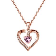 a pink heart shaped necklace with diamonds