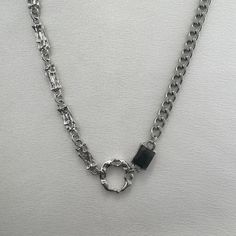 Elevate your style with our unisex link chain necklace. Perfect for streetwear, punk, and hip-hop looks. Designed with men and women in mind, this necklace adds a touch of urban flair to any outfit. Upgrade your wardrobe today! Necklace length 17.0 inch with 2.0 inch extension chain, Chain width 5 mm. Black Chain Link Jewelry For Streetwear, Edgy Metal Necklaces For Streetwear, Trendy Streetwear Necklaces With Silver Chain, Trendy Silver Chain Necklaces For Streetwear, Grunge Metal Necklaces For Streetwear, Trendy Silver Chain Necklace For Streetwear, Grunge Choker Jewelry For Streetwear, Edgy Streetwear Choker Necklace, Grunge Choker For Streetwear