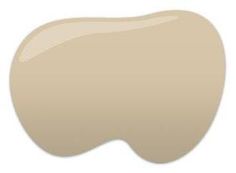 an image of a white tooth with some light brown paint on it's side