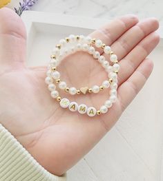 Cute faux pearl bead bracelet with gold letter beads! This bracelet is perfect for girls, women and toddlers! Customize with a name or word of your choice How to order 1)Select a size 2)Select how many bracelets 3)Add personalizatons and add to cart Always supervise children with bracelets not intended for children under 3. How To Make Name Bracelets, Pearl Beaded Bracelets With 8mm Beads As A Gift, Pearl White Beaded Bracelets With 8mm Beads For Gift, Pearl White Beaded Bracelets As Gift, Personalized White Bracelets With Heart Beads, Pearl Beaded Bracelets For Gifts, Pearl Beaded Bracelets As Gift, Adjustable Gold Beaded Bracelets As Gift For Mom, Adjustable Gold Beaded Bracelet As A Gift For Mom