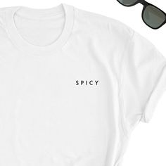 Spicy Minimalist Shirt, Spicy Tee, Spicy T-shirt, Spicy Shirt, Spicy Minimalistic Shirt, Spicy Unisex T-shirt, Spicy letters Shirt, Unisex You will fall in love with this unisex t-shirts, they feel soft and lightweight with the right amount of stretch, super confortable and flattering for both men and women. - 100% pre-shrunk cotton - Weight: 5.0 oz - Shoulder to shoulder tapping - Side-seamed Time for delivery - Processing and production time 1 to 6 business days (usually 2-3 days) - U.S Shippi Minimalist Short Sleeve Letter Print T-shirt, Trendy Everyday Shirt With Letter Print, White Tops With Funny Text For Everyday, Minimalist Letter Print T-shirt For Everyday, Minimalist Letter Print T-shirt, Everyday White T-shirt With Letter Print, Simple White T-shirt With Graphic Print, Simple White Graphic Print T-shirt, Simple White Tops With Text Print