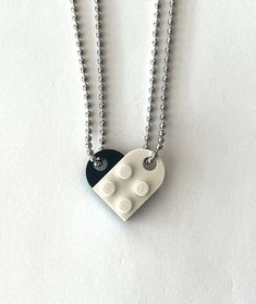 Matching BFF Heart Friendship Necklace Set - Made with authentic LEGO® Bricks!We never use fake/imitation bricks. Everything is authentic.**SHIPS NEXT BUSINESS DAY** This beautiful set contains 2 very high-quality made-in-USA ball chain necklaces that will make a whole heart. Chains are 24" long. LEGO® Brick is ~5/8" wide x ~1" long.*Please review "Shipping & Policies" section. *Not recommended for children under 10. These products are made using LEGO® elements. LEGO®, and the LEGO logo, are Friendship Necklace With Heart Pendant, Nickel-free Heart-shaped Friendship Necklaces, Nickel Free Heart Shaped Necklaces For Friendship, Nickel-free Heart-shaped Necklace For Friendship, White Necklace For Friendship And Mother's Day, White Necklace For Friendship On Mother's Day, Heart-shaped Friendship Necklaces With Adjustable Chain, Friendship Heart Necklace With Adjustable Chain, Heart-shaped Friendship Necklace With Adjustable Chain