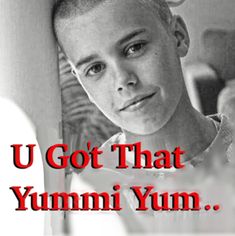 a young boy is looking at the camera with an ad in front of him that says, u got that yum