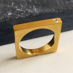 Sign up now and get 10% off your first purchasehttps://signup.majdanrocks.comThis is a lovely, minimal ring, which looks great worn on its own or 2 stacked together. It can also be used as a simple yet sophisticated wedding band. Available in Matt finish.All my jewellery is handmade in London, UK. Made from sterling silver and available in 18ct gold plate, 18ct rose gold plate and silver (unplated). Set with one 1.5 mm SI quality diamond. Thickness of band: 3 mmWeight: 6 gIf you would like to or Wedding Bands Women, Ring Gold Diamond, Gold Band Wedding Ring, Band Wedding Ring, Stacked Wedding Rings, Men Rings, Diamond Stacking Rings, Rose Gold Diamond Ring, Etsy Gold Ring