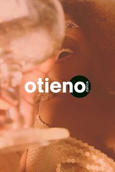 a woman holding a wine glass with the word otteno in front of her