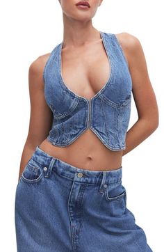 Down-to-earth denim gets a flirty spin with this cropped vest boasting bustier-inspired seams. 18 1/2" length (size medium) Front hook-and-eye closure V-neck 79% cotton, 20% preconsumer cotton, 1% elastane Machine wash, tumble dry Made in Turkey Black Owned/Founded Trendy Cropped Vest In Medium Wash, Trendy Cropped Medium Wash Vest, Trendy Medium Wash Cropped Vest, Cropped Medium Wash Vest For Spring, Fitted Sleeveless Denim Vest In Medium Wash, Chic Fitted Dark Wash Denim Vest, Chic Cropped Denim Vest In Medium Wash, Chic Cropped Medium Wash Denim Vest, Fitted Medium Wash Sleeveless Tank Top