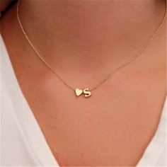 This gorgeous initial heart necklace is a must have accessory. Perfect to wear single or purchase various initials and stack them together to represent those you love! Mixed Fractions, Heart Initial Necklace, Initial Heart Necklace, Japan Jewelry, Dainty Initial Necklace, Asian Music, Heart Choker Necklace, Stacking Bands, Heart Choker