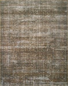 an area rug with brown and beige tones