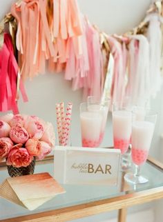 a table with pink and gold decorations on it