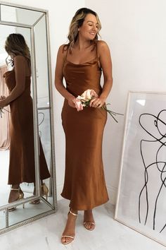 Approx length: 110cm Cowl neckline True to size Silky Stretchy fabric 100% Polyester Colour: Rust Care: Hand was only - Iron inside out on low heat Model is wearing size 8 Model is 5'3 height Copper Bridesmaid Dresses, Brown Satin Dress, Brown Silk Dress, Mocha Dress, Rust Color Dress, Oh Hello Clothing, Brown Bridesmaid Dresses, Rust Bridesmaid Dress, Silk Bridesmaid Dresses