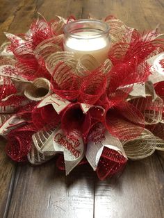 a candle is sitting on top of a wreath