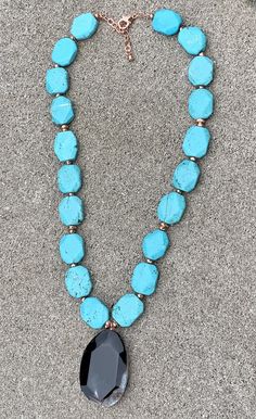 Back to Blue Turquoise Magnesite & Agate Pendant Necklace Barse Genuine Agate Genuine Turquoise Magnesite Genuine Hematite & Copper Genuine Bronze Lobster Clasp Closure Crafted and Finished By Hand CCRUN03MUC Approximate Measurements: Length- 16"-18"+ 2" Extender; Pendant Slab Slice- 1 3/4" Live your life in color with this beautiful statement pendant necklace. Pair this with a simple white V-neck t-shirt, white jeans, a denim jacket and you will be ready for a night out on the town with Turquoise Agate Gemstone Beaded Necklaces, Turquoise Agate Beaded Necklace, Turquoise Agate Beaded Necklace With Gemstones, Turquoise Agate Gemstone Beaded Necklace, Blue Turquoise Necklace With Large Teardrop Stone, Turquoise Agate Jewelry With Large Stone, Handmade Turquoise Blue Agate Necklace, Handmade Blue Turquoise Agate Necklace, Blue Turquoise Teardrop Necklace With Gemstone Beads