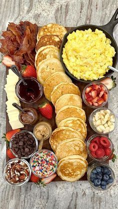 an assortment of breakfast foods on a tray