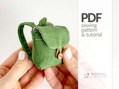 a person holding a small green bag with buttons in it's pocket and the text, sewing pattern & tutors