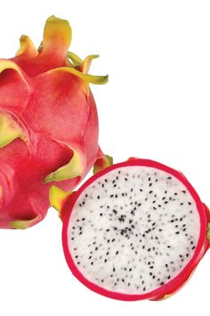 a dragon fruit cut in half on a white background